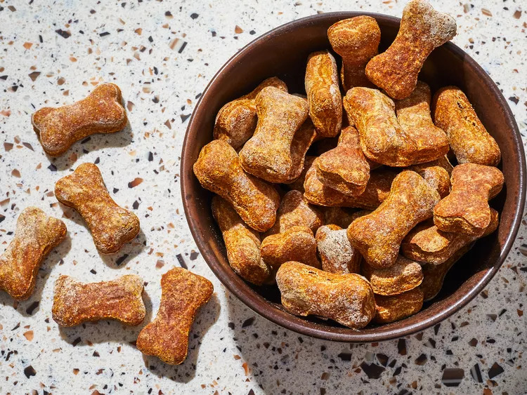 Dog treats which are kept into a bowl and five are on the shelf.
Tips For Taking Care For A Pet Dog includes to give limited treats to your pet dog